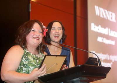 Rachael Lucas, ABC Gippsland, won, Best Feature Story – Online – sponsored by Marcus Oldham College, with awards emcee Prue Bentley in the background.